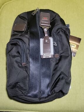 Tumi Black Nylon Sling Bag with Brown Leather Accents